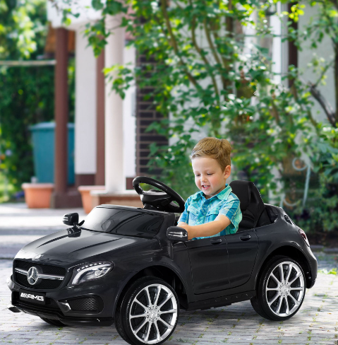 kid driving a ride on mercedes benz